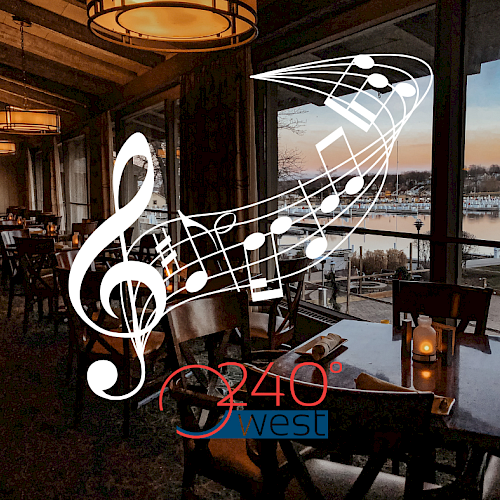 A dining area with musical notes and a treble clef, overlooking a waterfront view at sunset. Text reads 