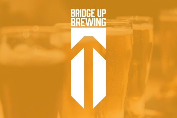 Beer logos and tall glass pints with a white geometric emblem and “BRIDGE UP BREWING” text on a warm orange background.