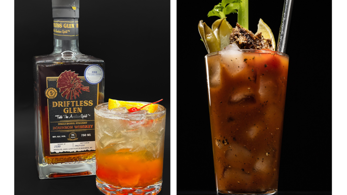 The image shows a Driftless Glen whiskey bottle with a cocktail glass on the left and a Bloody Mary garnished with celery and olives on the right.