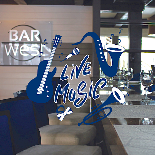 Image of a bar interior with empty seats and a sign that reads 