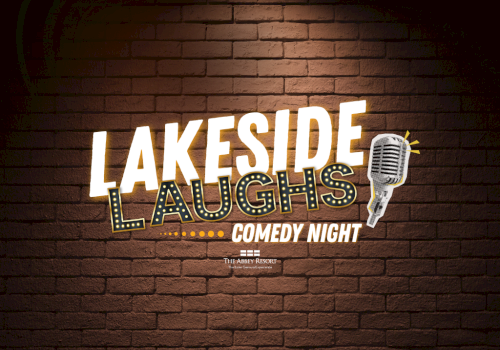 Lakeside Laughs Comedy Night at The Abbey Resort, with a vintage microphone on a brick wall background.