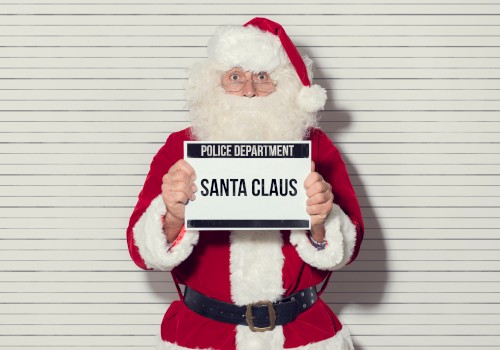 Santa Claus holding a police department sign in front of a lineup background. Ends the sentence.