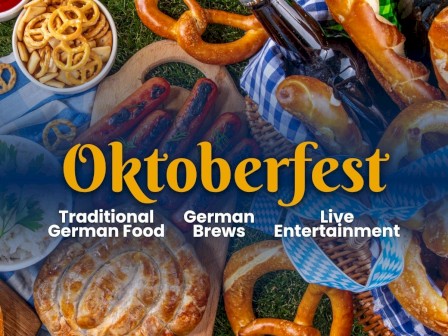 This image features traditional German Oktoberfest food, live entertainment, and German brews.