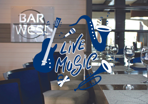 Image of a bar interior with empty seats and a sign that reads 