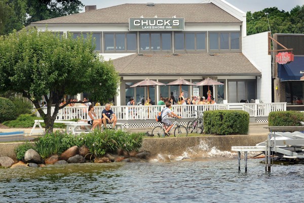 The image shows a waterfront restaurant named 