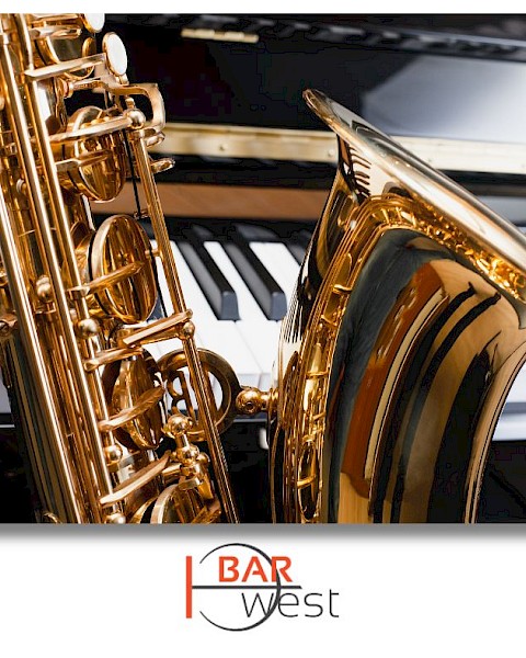 A saxophone and a piano keyboard are shown in the image, with a logo for 